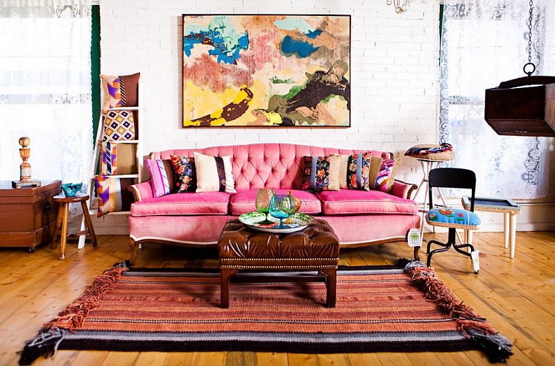 eclectic living room with large red couch bohemian chic